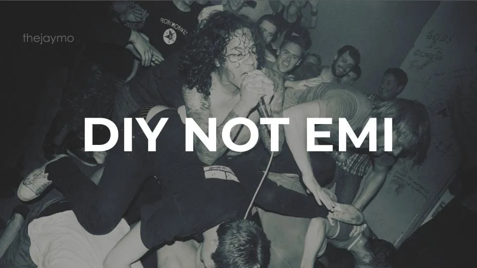 Featured image for Solarpunk: Life in the Future Beyond the Rusted Chrome of Yestermorrow - a black and white photo of a singer in a chaotic mosh pit with the text DIY NOT EMI.
